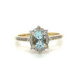 10K Yellow Gold 7x5 Oval Aquamarine and 1/4 Carat Total Weight Diamond Ring