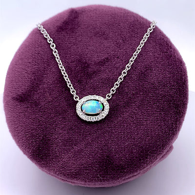 14K White Gold .29CT Opal and 1/8 Carat Total Weight (16 Brilliant) Diamond Pendant