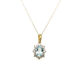 10K Yellow Gold 7X5 Oval Aquamarine and 1/5 Carat Total Weight Diamond Necklace