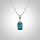 14K White Gold 1.25CT 5x7mm Emerald Cut Blue Zircon and 0.035 Carat Total Weight (3) Diamond Pendant
