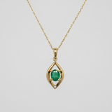 14K Yellow Gold 0.25CT 4x5mm Oval Emerald and 0.007CT (1) Diamond Pear-Shaped Pendant