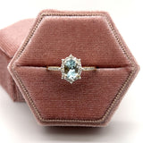 10K Yellow Gold 7x5 Oval Aquamarine and 1/4 Carat Total Weight Diamond Ring