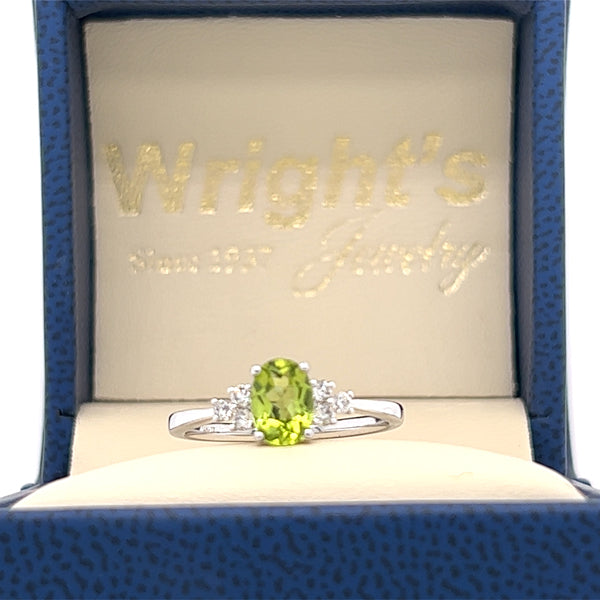 14K White Gold .94CT Oval Peridot and .15 Carat Total Weight (6) Diamond Ring