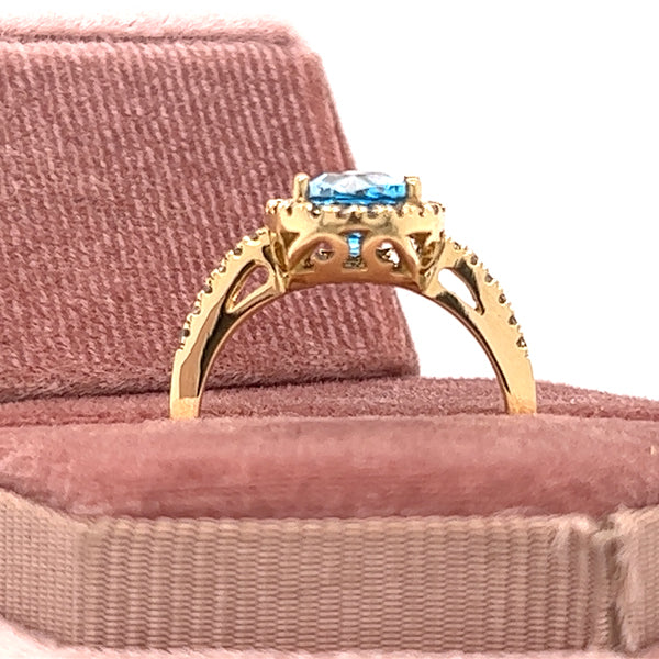 14K Yellow Gold 2CT Checkerboard Cut Oval Blue Topaz and .24 Carat Total Weight Diamond Ring