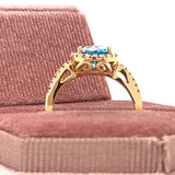 14K Yellow Gold 2CT Checkerboard Cut Oval Blue Topaz and .24 Carat Total Weight Diamond Ring