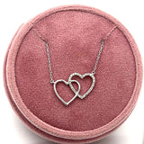 Sterling Silver Double Interlocking Heart Pendant with 1/10 CTW Diamonds