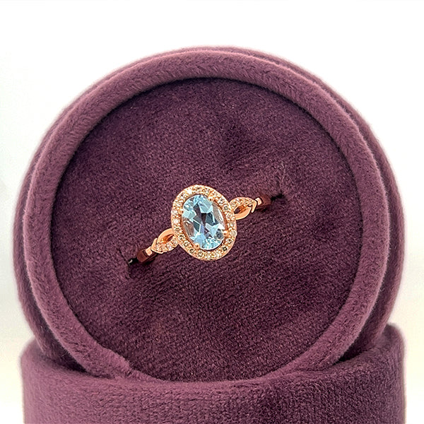 14K Rose Gold Oval Aquamarine and 0.13 Carat Total Weight Diamond Ring