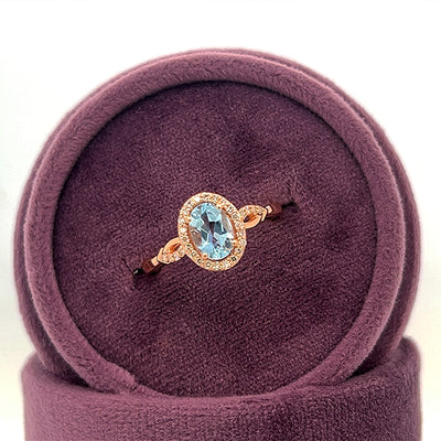 14K Rose Gold Oval Aquamarine and 0.13 Carat Total Weight Diamond Ring