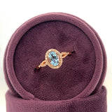 14K Rose Gold Oval Aquamarine and 0.13 Carat Total Weight Diamond Ring