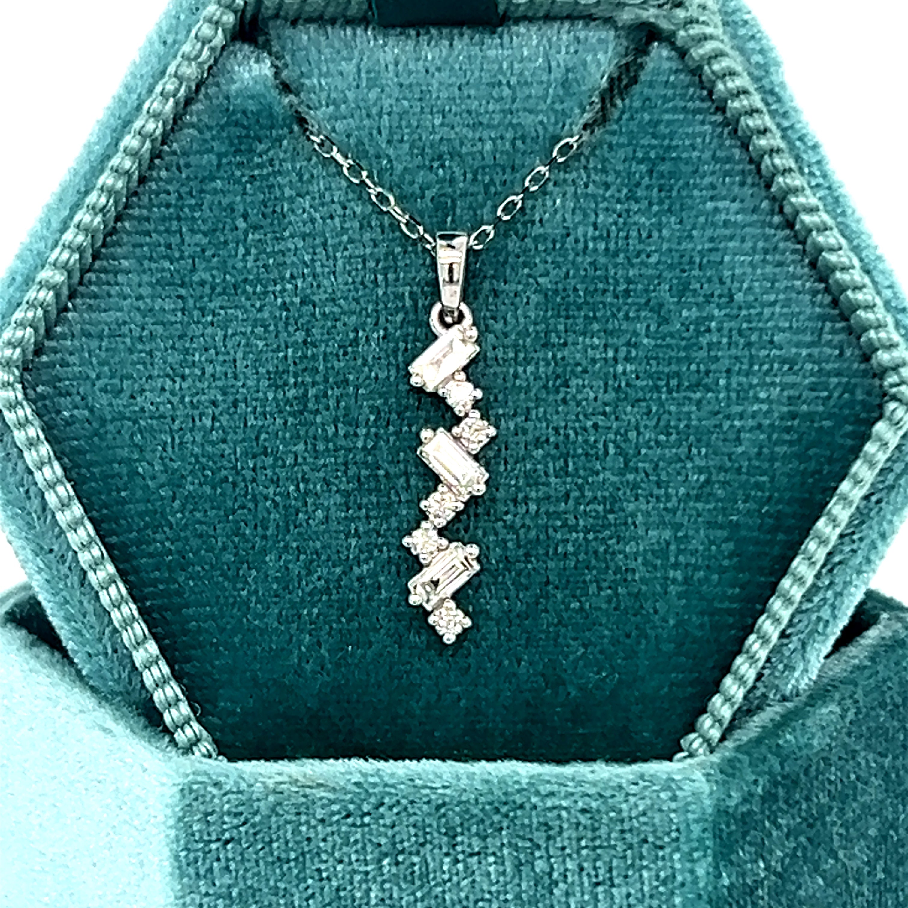 14K White Gold .22 Carat Total Weight Diamond Vertical Scatter Pendan