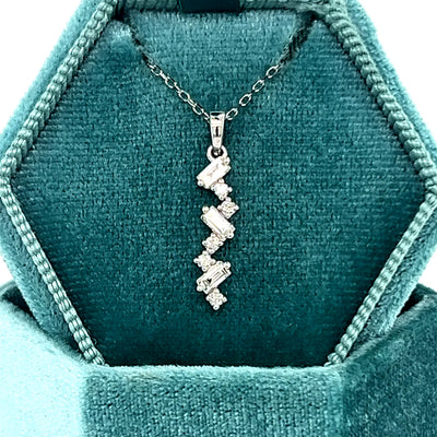 14K White Gold .22 Carat Total Weight Diamond Vertical Scatter Pendan