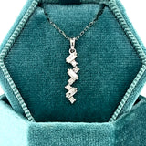 14K White Gold .22 Carat Total Weight Diamond Vertical Scatter Pendan
