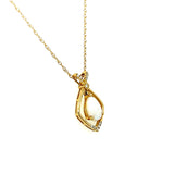 14K Yellow Gold 6x9mm 0.72CT Opal and 0.078 Carat Total Weight (12) Diamond Pendant