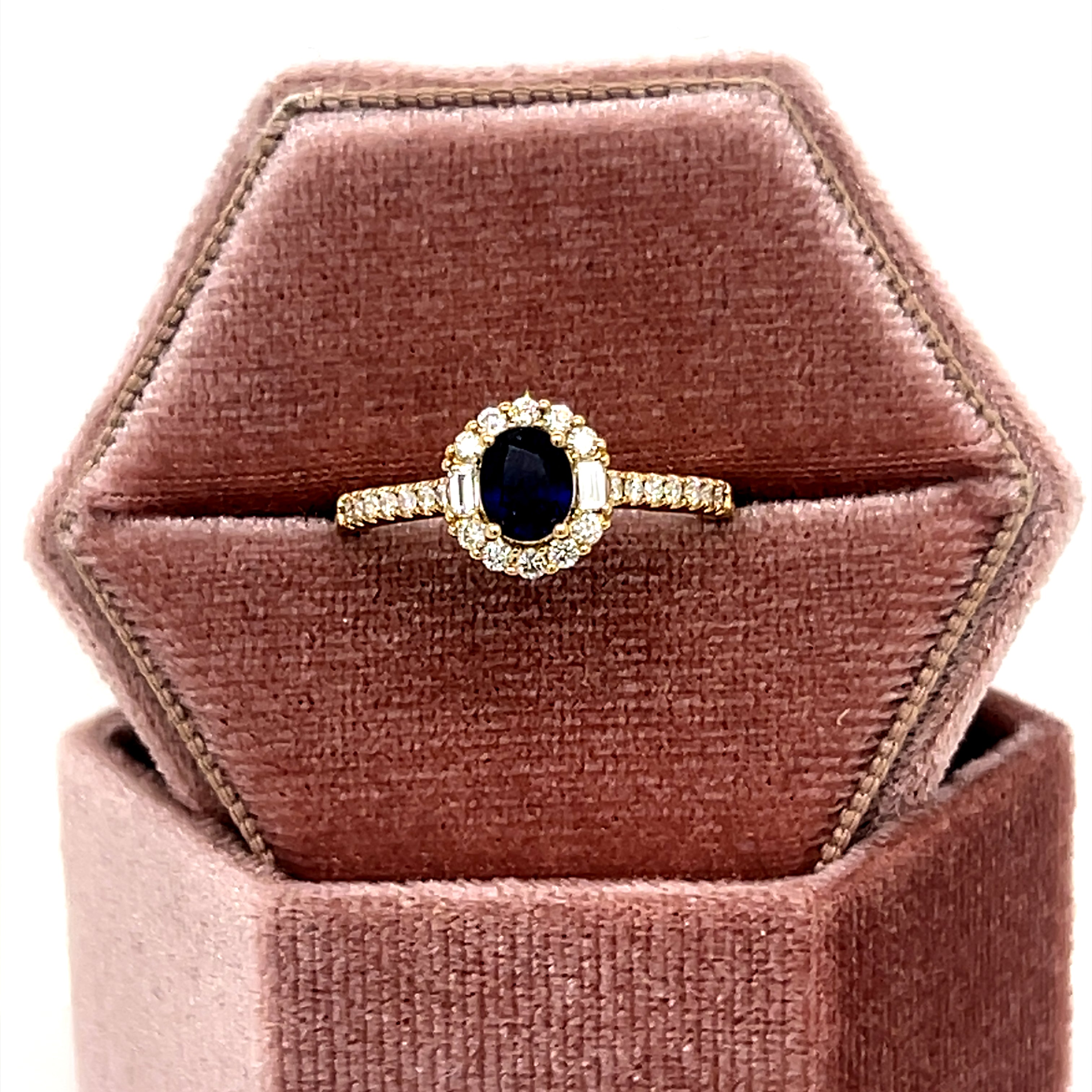 14K Yellow Gold .16CT Oval Sapphire .36 Carat Total Weight Baguette Diamond and Round Diamond Ring