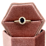 14K Yellow Gold .16CT Oval Sapphire .36 Carat Total Weight Baguette Diamond and Round Diamond Ring