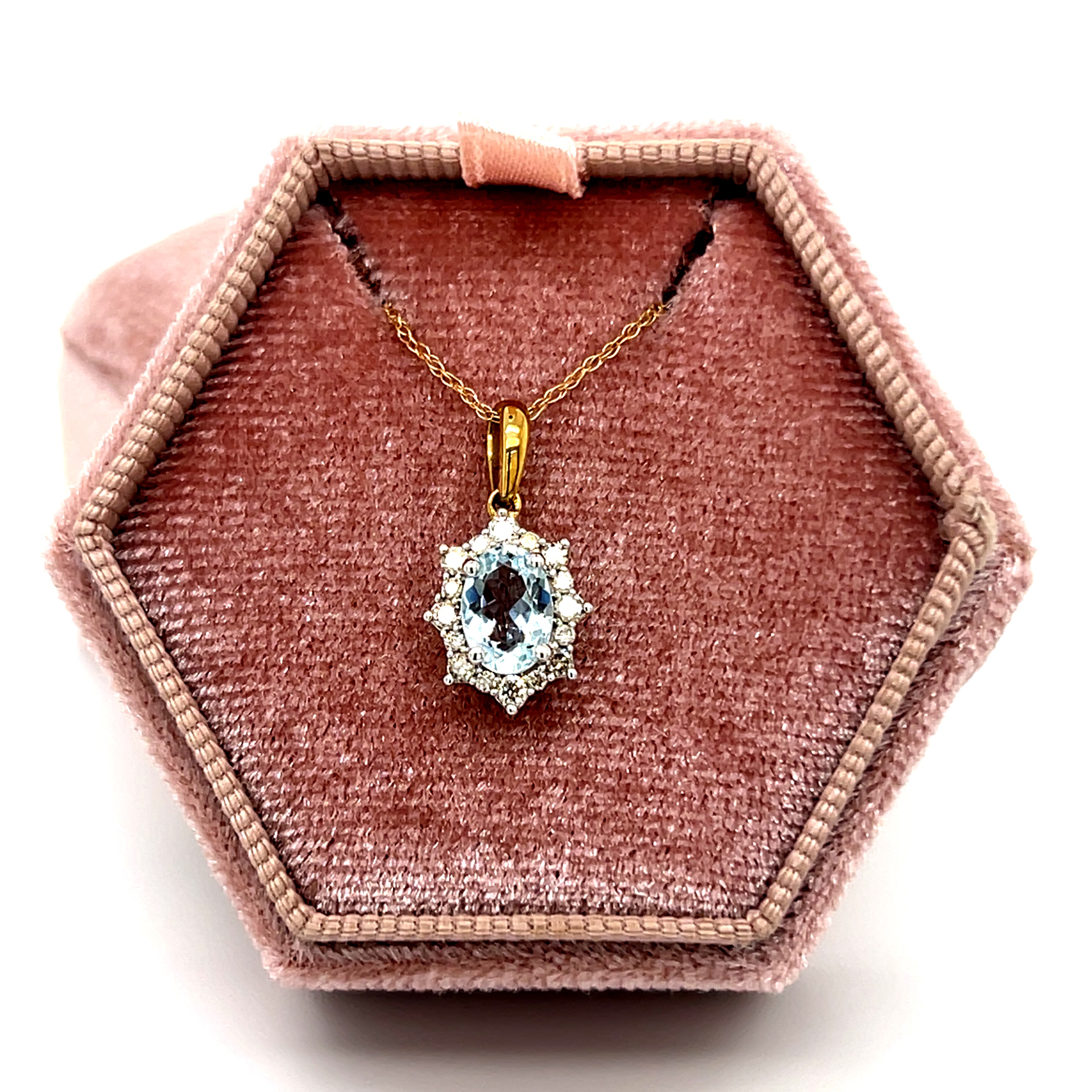 10K Yellow Gold 7X5 Oval Aquamarine and 1/5 Carat Total Weight Diamond Necklace