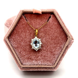 10K Yellow Gold 7X5 Oval Aquamarine and 1/5 Carat Total Weight Diamond Necklace