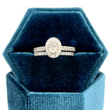 14K White Gold 1.00 Carat Total Weight Oval Halo Diamond Bridal Wedding Engagement Ring Set with .25CT 5x3mm Diamond Center and Peekaboo Diamond in the Gallery of Ring.