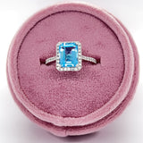 14K White Gold 7X9mm 2.73CT Emerald Cut Blue Topaz and 0.307 Carat Total Weight (42) Diamond Ring