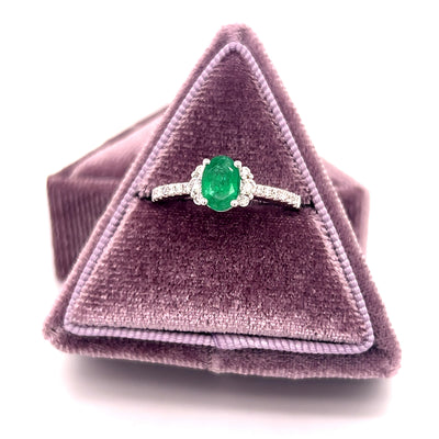 14K White Gold 0.69CT Oval Emerald and 0.24 Carat Total Weight (18) Round Diamond Ring