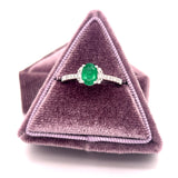 14K White Gold 0.69CT Oval Emerald and 0.24 Carat Total Weight (18) Round Diamond Ring