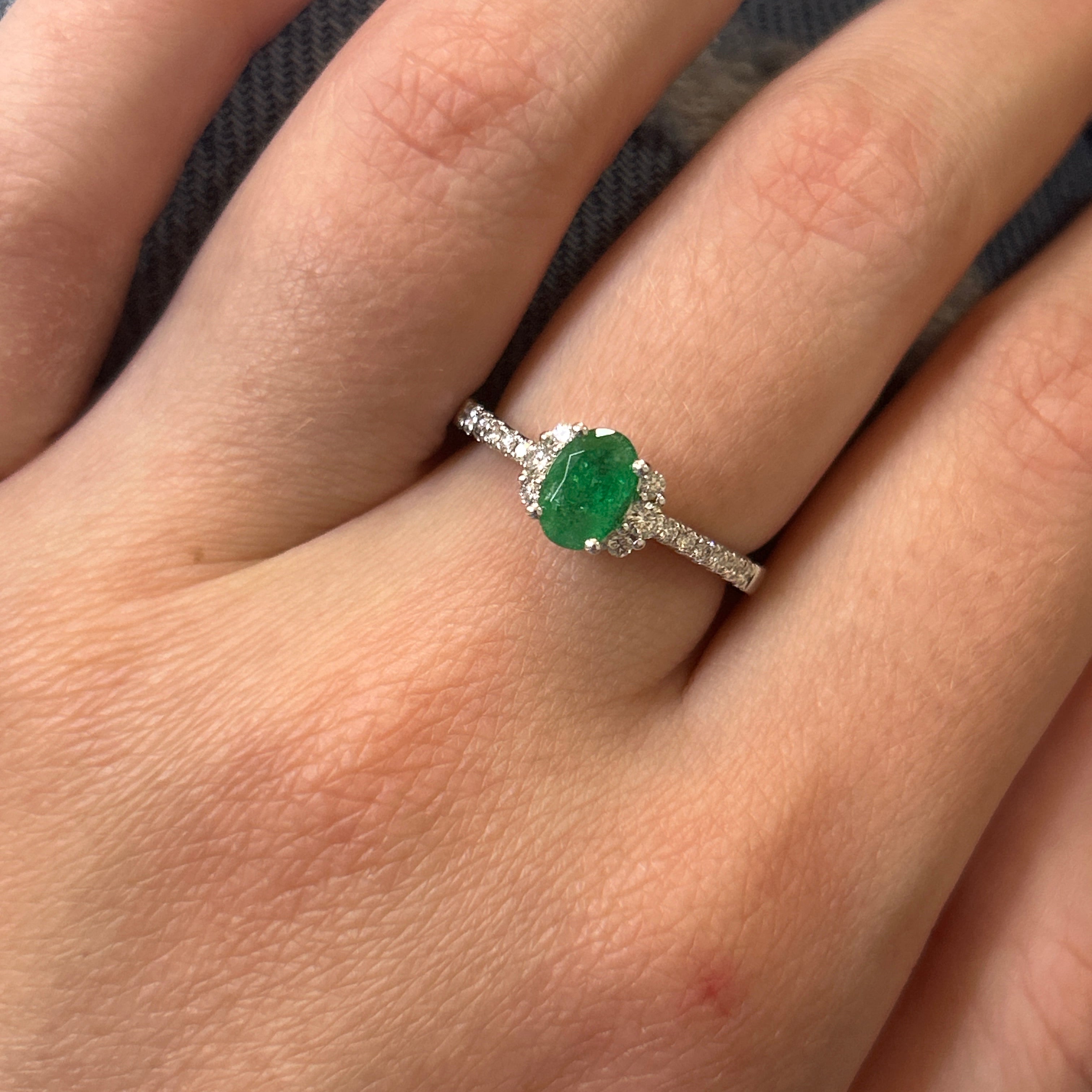 14K White Gold 0.69CT Oval Emerald and 0.24 Carat Total Weight (18) Round Diamond Ring