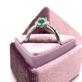 14K White Gold 0.69CT Oval Emerald and 0.24 Carat Total Weight (18) Round Diamond Ring