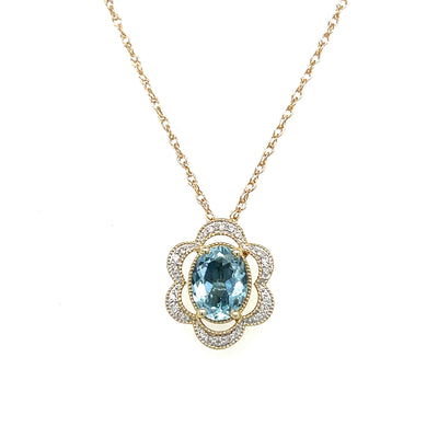 14K Yellow and White Gold 1.081CT Oval Aquamarine and 0.082 Carat Total Weight Flower Pattern Diamond Pendant