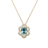 14K Yellow and White Gold 1.081CT Oval Aquamarine and 0.082 Carat Total Weight Flower Pattern Diamond Pendant