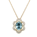 14K Yellow and White Gold 1.081CT Oval Aquamarine and 0.082 Carat Total Weight Flower Pattern Diamond Pendant