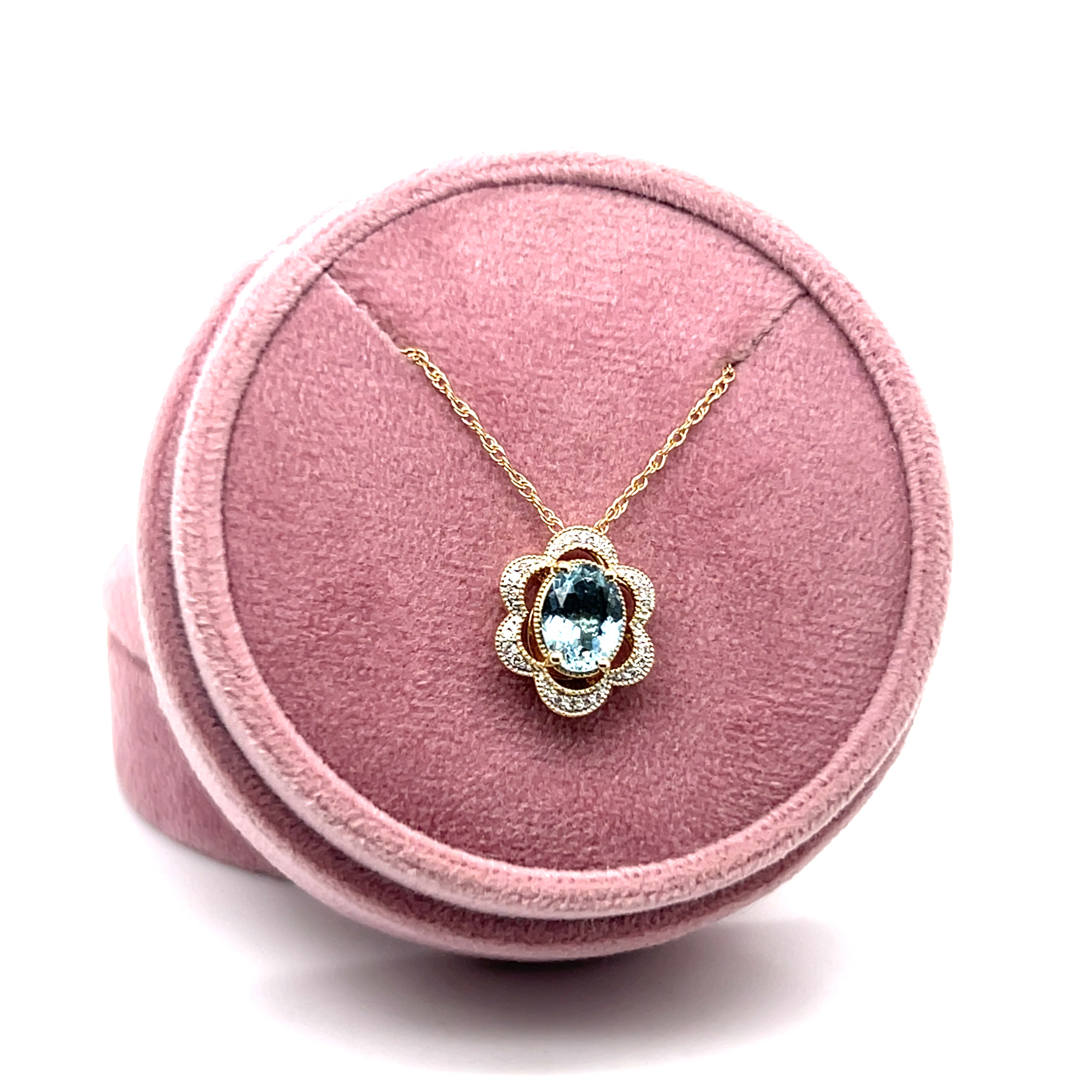 14K Yellow and White Gold 1.081CT Oval Aquamarine and 0.082 Carat Total Weight Flower Pattern Diamond Pendant