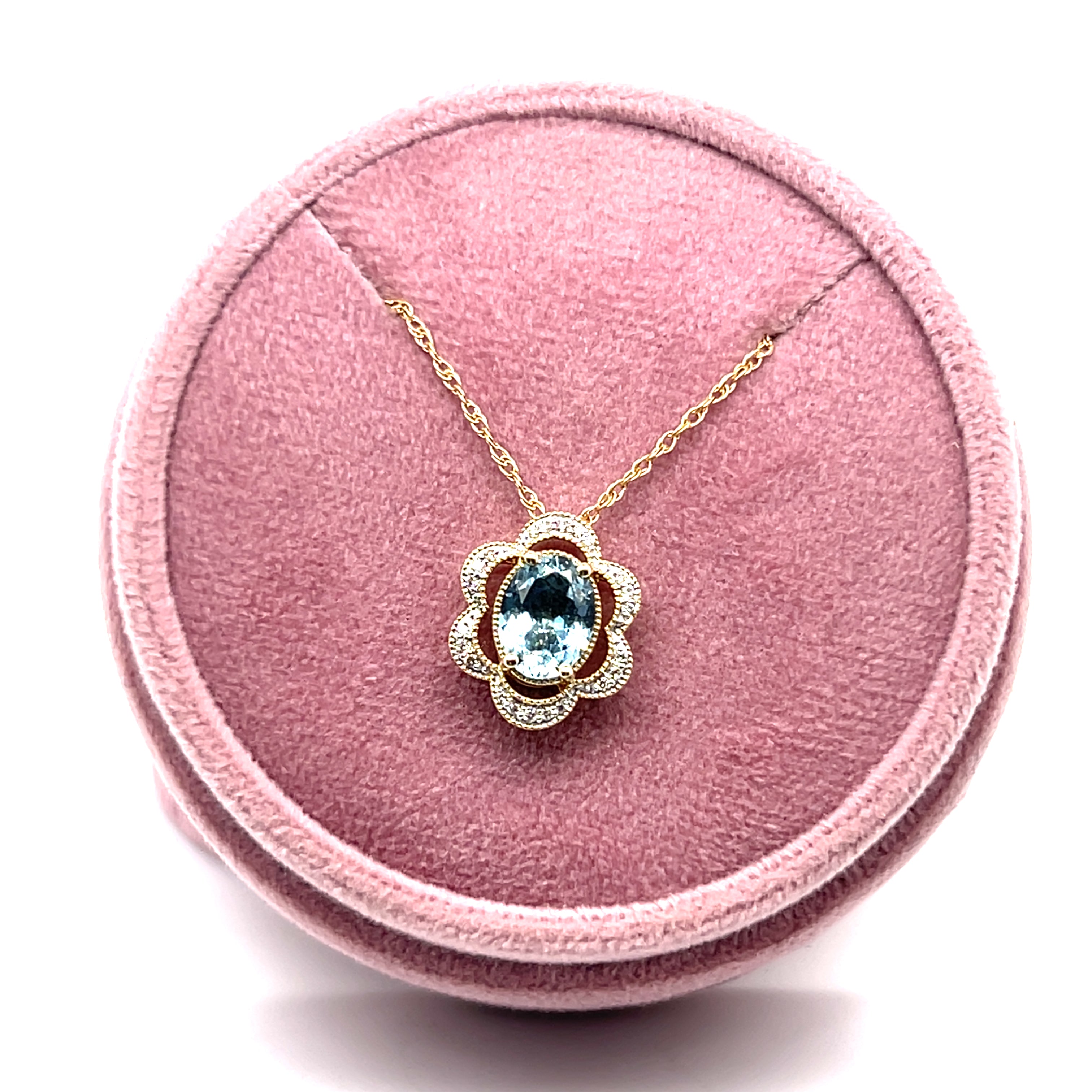 14K Yellow and White Gold 1.081CT Oval Aquamarine and 0.082 Carat Total Weight Flower Pattern Diamond Pendant