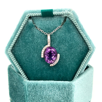 Sterling Silver 2.00CT Oval Amethyst and 0.06CTW White Cubic Zirconia Partial Bezel Set Pendant Necklace
