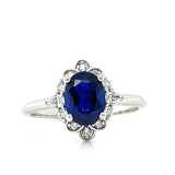 WJS Custom Set 14K White Gold 1.7 Carat Oval Lab Grown Blue Sapphire and 0.23 Carat Total Weight Lab Grown Diamond Ring with Floral/ Vintage Accents