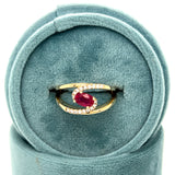 WJS Custom Set Oval 0.60 Carat Ruby and 0.12 Carat Total Weight Natural Diamond Bypass Ring
