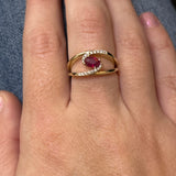 WJS Custom Set Oval 0.60 Carat Ruby and 0.12 Carat Total Weight Natural Diamond Bypass Ring