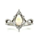 WJS Custom Set 0.45 Carat Pear Cut White Fiery Opal Accented by 0.19 Carat Total Weight of Marquise and Round Diamonds in a Milgrain Criss-Cross Ring