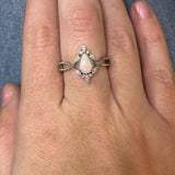 WJS Custom Set 0.45 Carat Pear Cut White Fiery Opal Accented by 0.19 Carat Total Weight of Marquise and Round Diamonds in a Milgrain Criss-Cross Ring