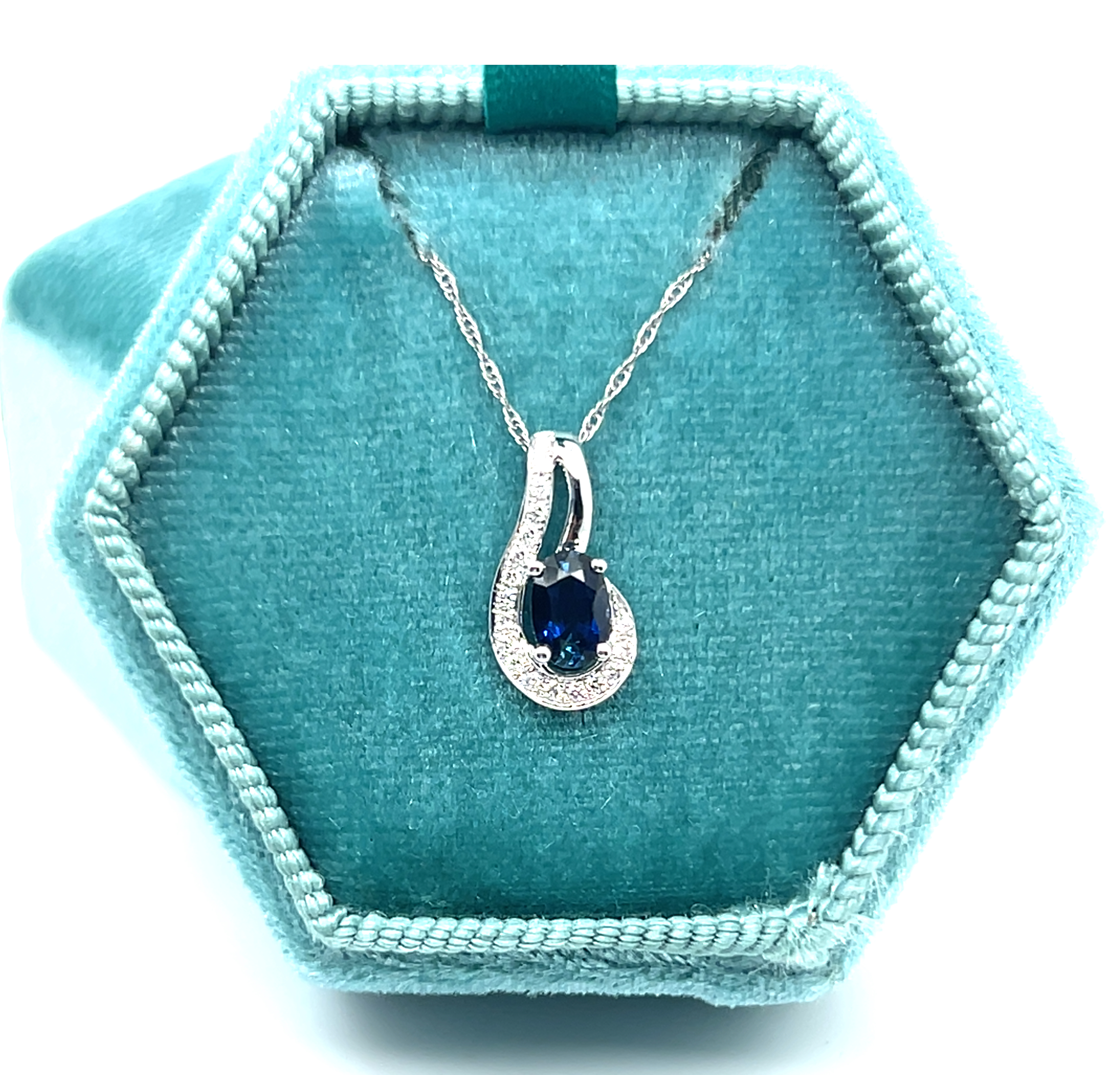14K White Gold 0.49CT 4x6mm Oval Sapphire and 0.094 Carat Total Weight (18) Diamond Pendant