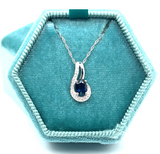 14K White Gold 0.49CT 4x6mm Oval Sapphire and 0.094 Carat Total Weight (18) Diamond Pendant