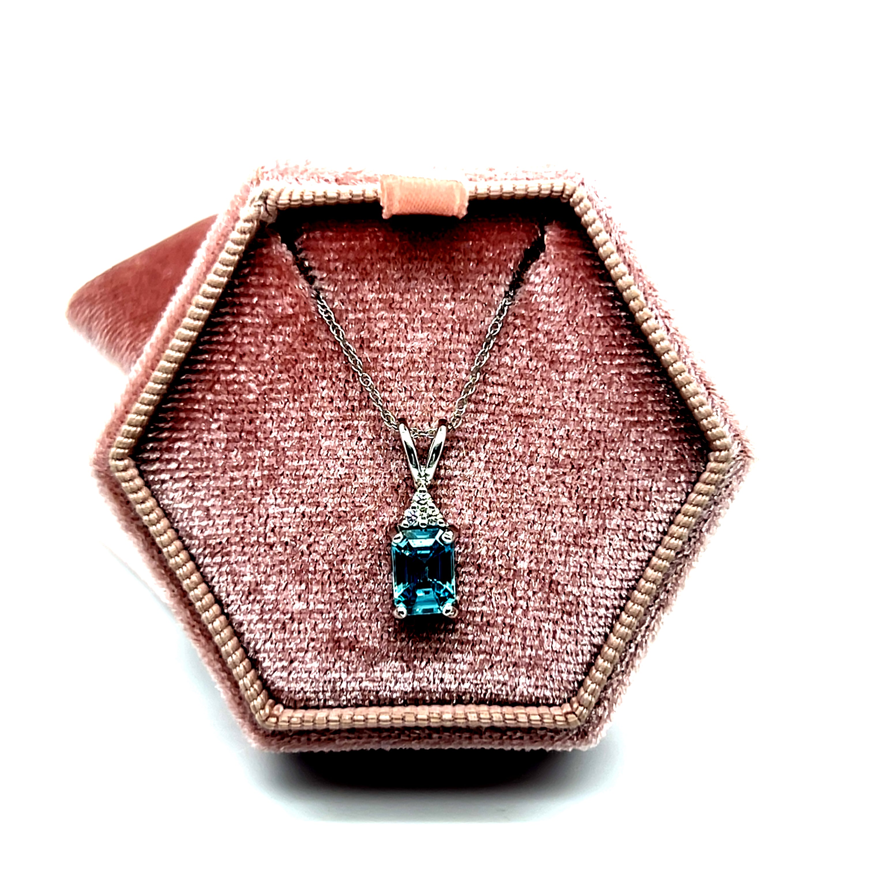 14K White Gold 1.25CT 5x7mm Emerald Cut Blue Zircon and 0.035 Carat Total Weight (3) Diamond Pendant