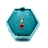 14K Yellow Gold 0.34CT 4x5mm Oval Ruby and 0.02 Carat Total Weight (4) Diamond Pendant