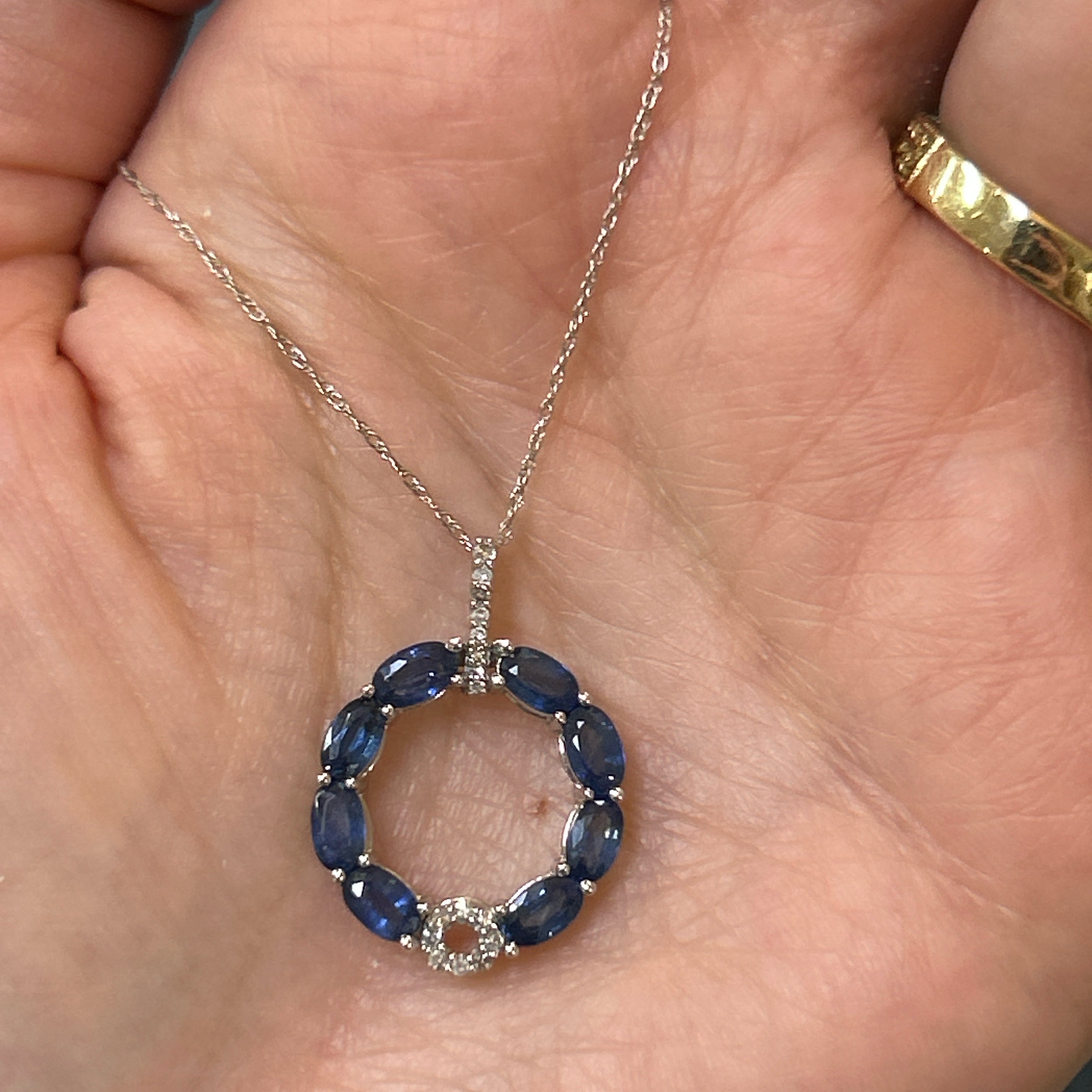 14K White Gold 2.50 Total Gem Weight (8) Oval Blue Sapphire Accented by 0.12 Carat Total Weight Natural Diamond Circle Pendant
