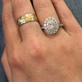 14K White Gold 0.50CT (1) Oval Diamond Center & 1.01 Carat Total Weight (41) Round Diamond Engagement Ring