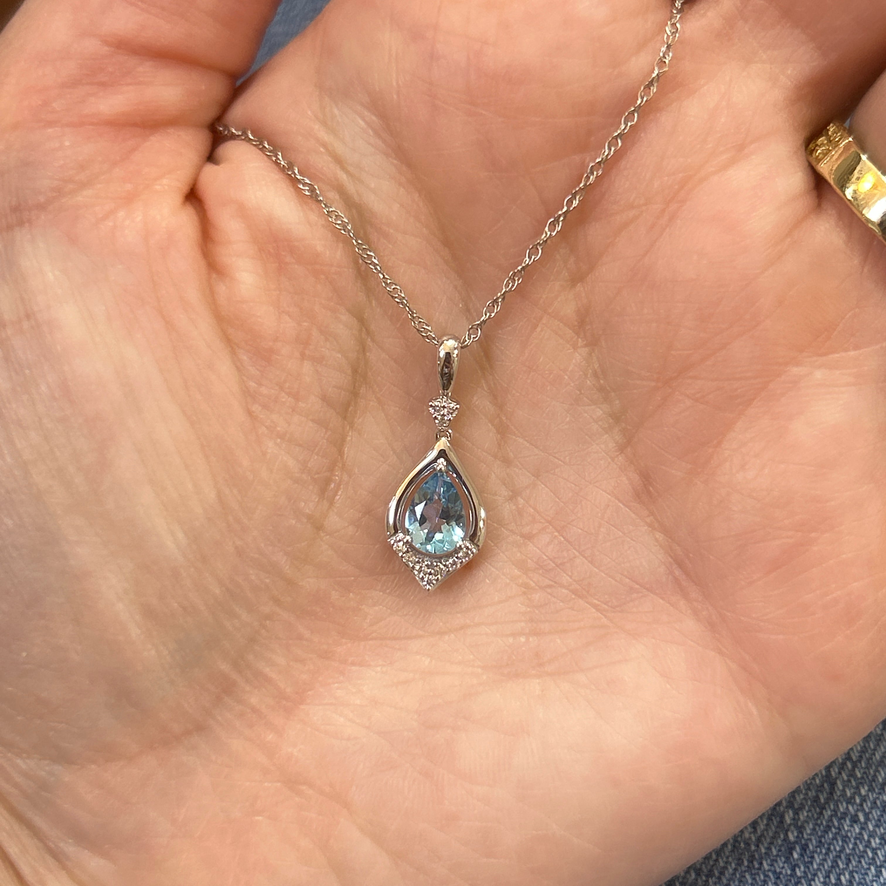14K White Gold 0.78CT (1) Pear Blue Topaz & 0.07 Carat Total Weight (10) Round Diamond Pendant