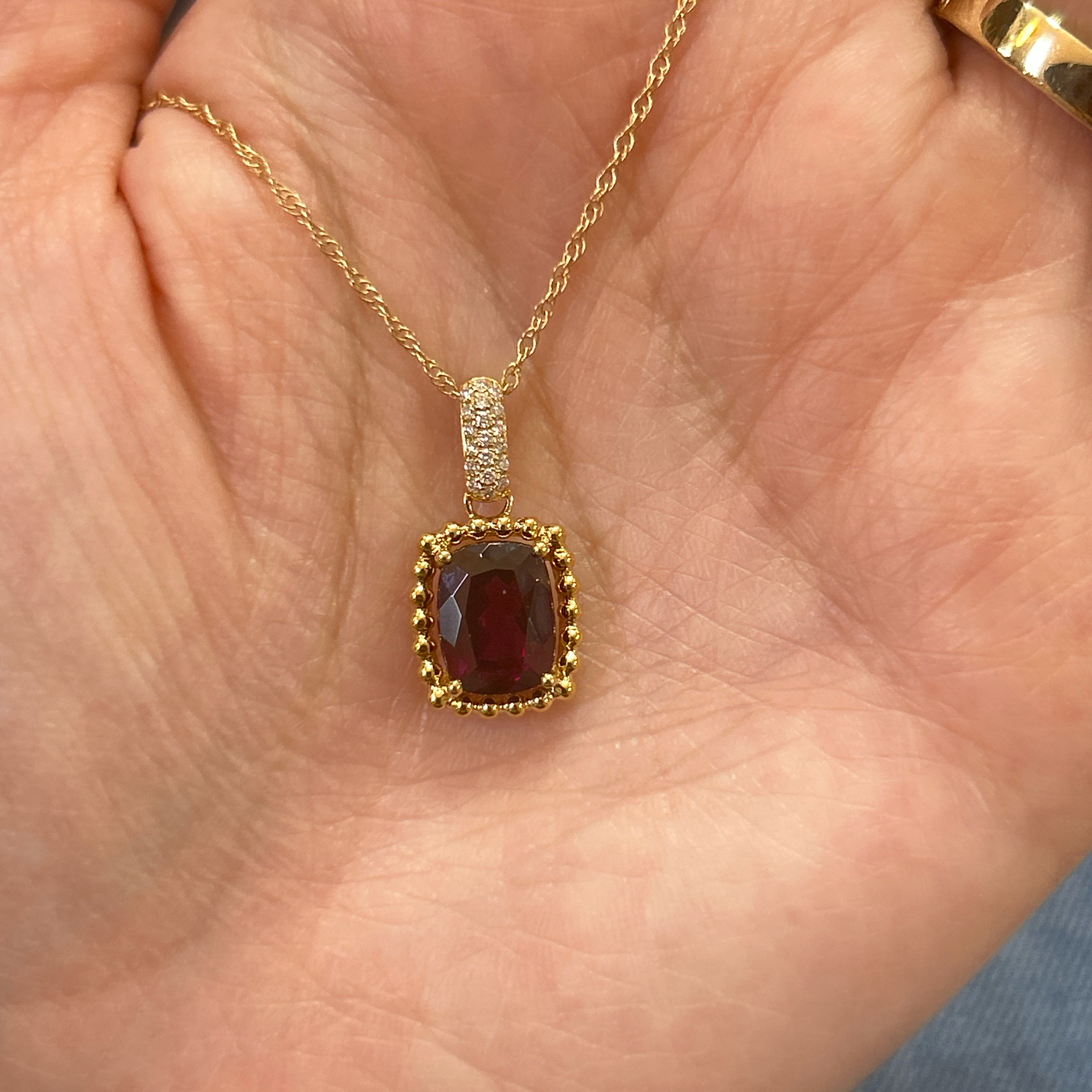 14K Yellow Gold 2.77CT (1) Cushion ROGR & 0.07 Carat Totala Weight (19) Round Diamond Pendant