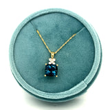 14K Yellow Gold 2.94CT (1) Cushion London Blue Topaz & 0.12 Carat Total Weight (4) Round Diamond Pendant