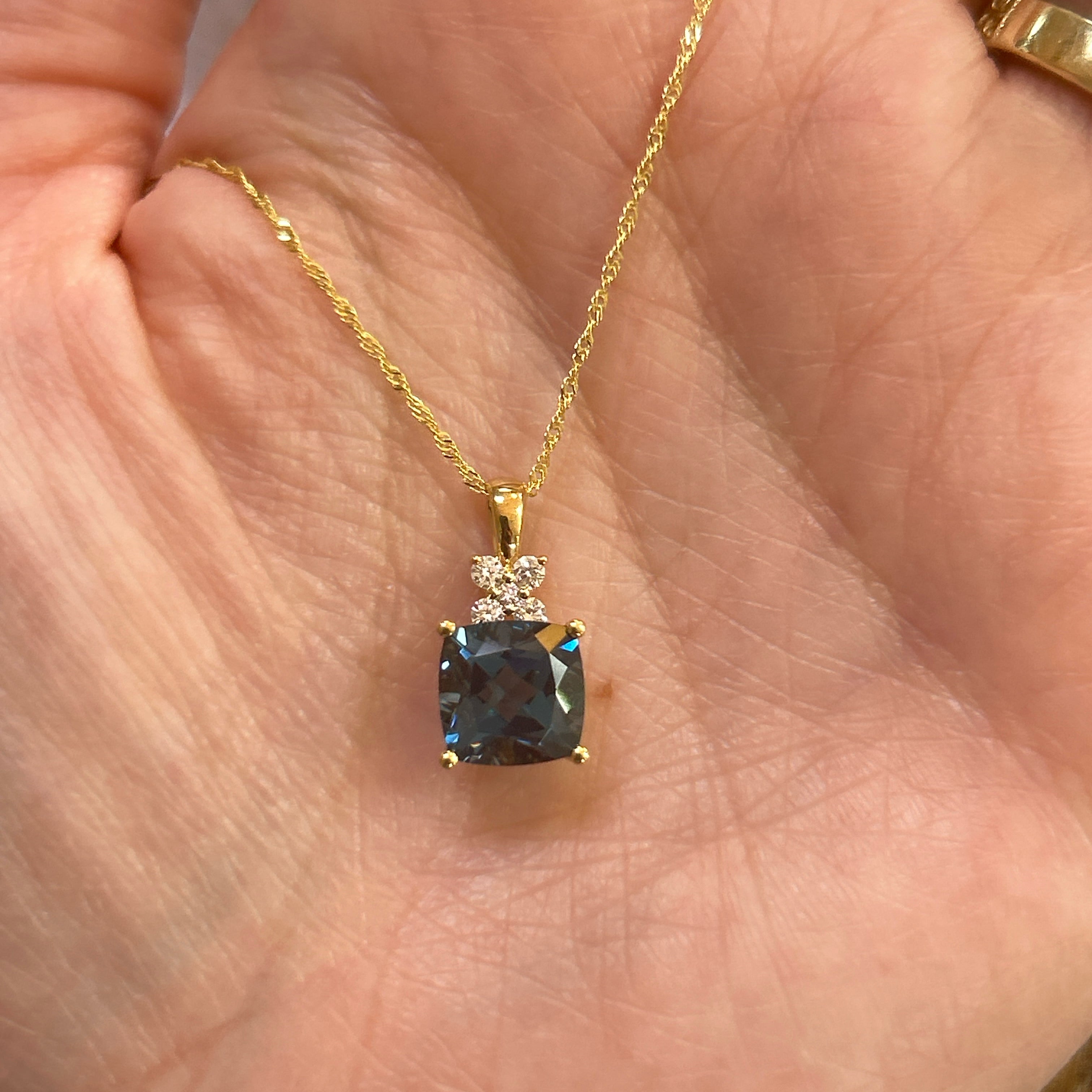 14K Yellow Gold 2.94CT (1) Cushion London Blue Topaz & 0.12 Carat Total Weight (4) Round Diamond Pendant