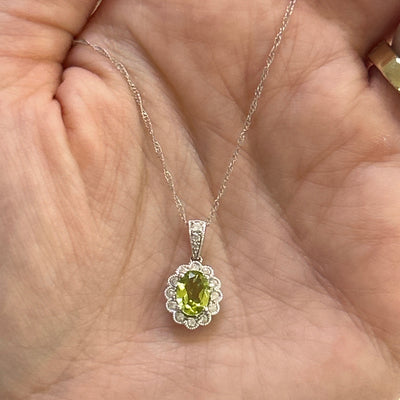 10K White Gold Oval Peridot and 0.15 Carat Total Weight Floral Diamond Pendant