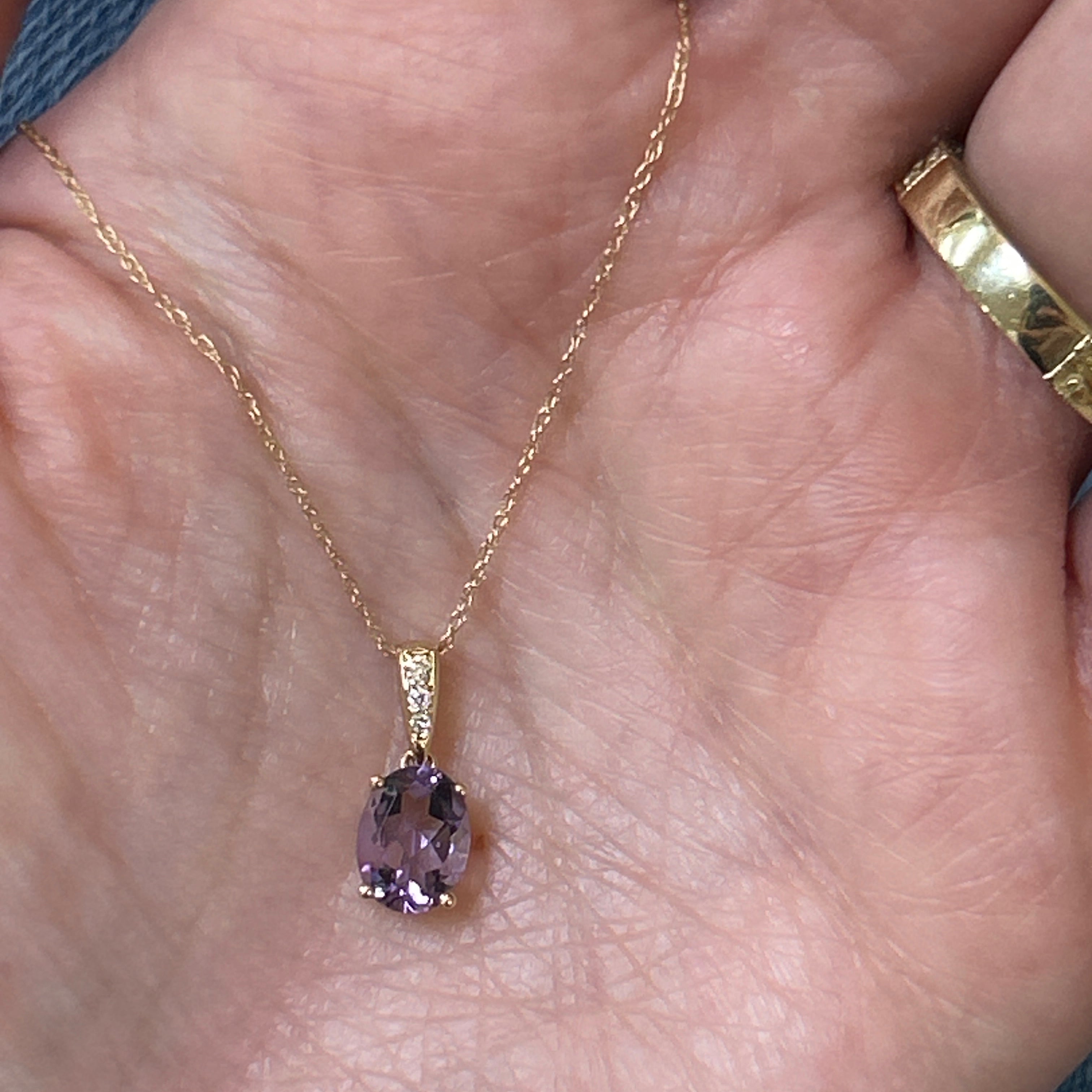 14K Yellow Gold 0.49g 1.16CT Oval Amethyst and 0.03 Carat Total Weight (3) Round Diamond Pendant